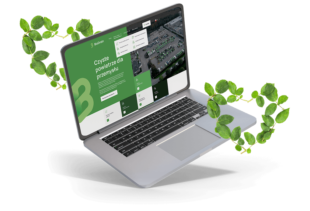 Laptop z widokiem projektu strony internetowej BioDrain dla branży ochrony środowiska, prezentującej technologie eliminacji odorów i rozwiązania dla przemysłu.